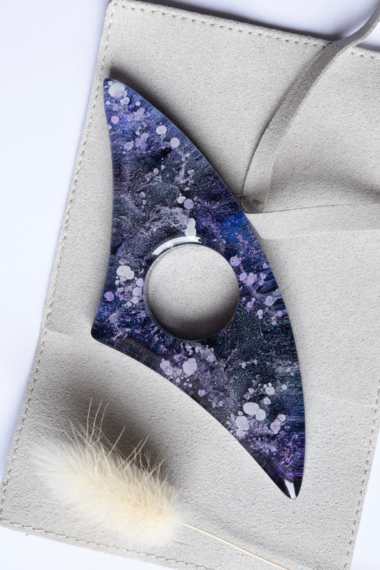 Handmade Page Holder with purple and white design on a gray surface