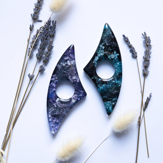 Two handmade page holders on a white background with lavender and cat tails.