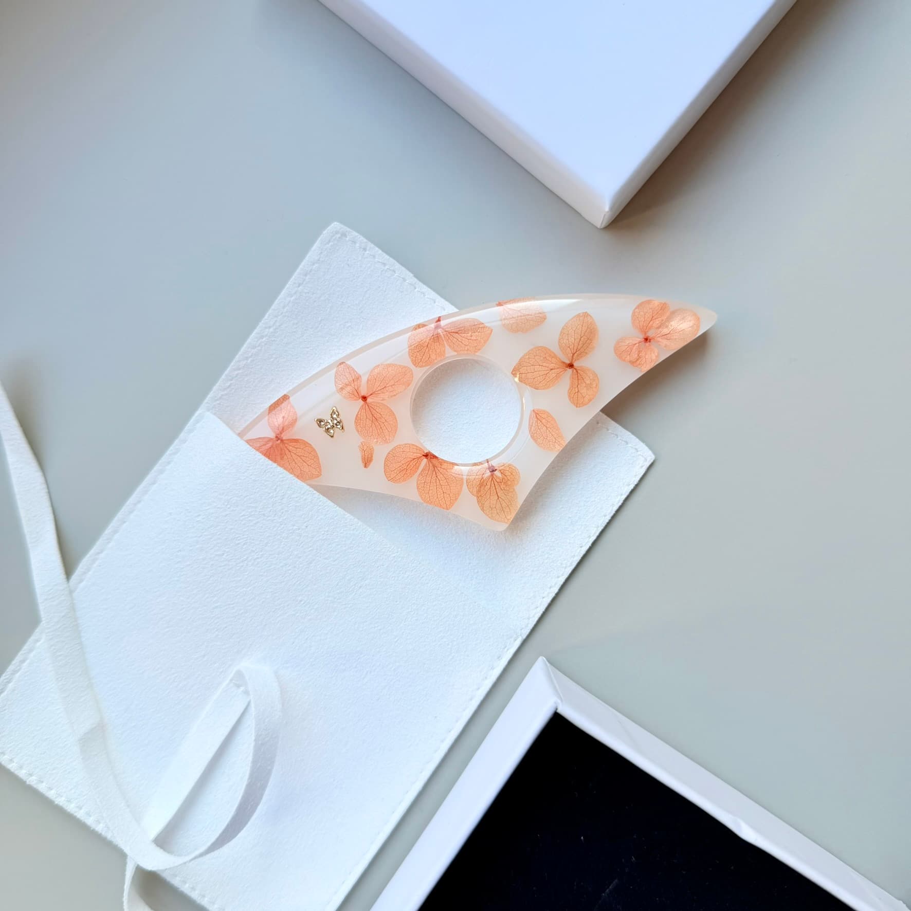 Handmade Page Holder with floral pattern on a white surface