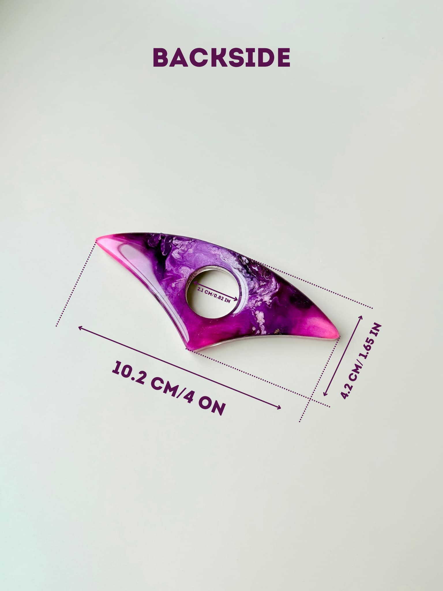 Purple and pink handmade page holder with measurements on a white background