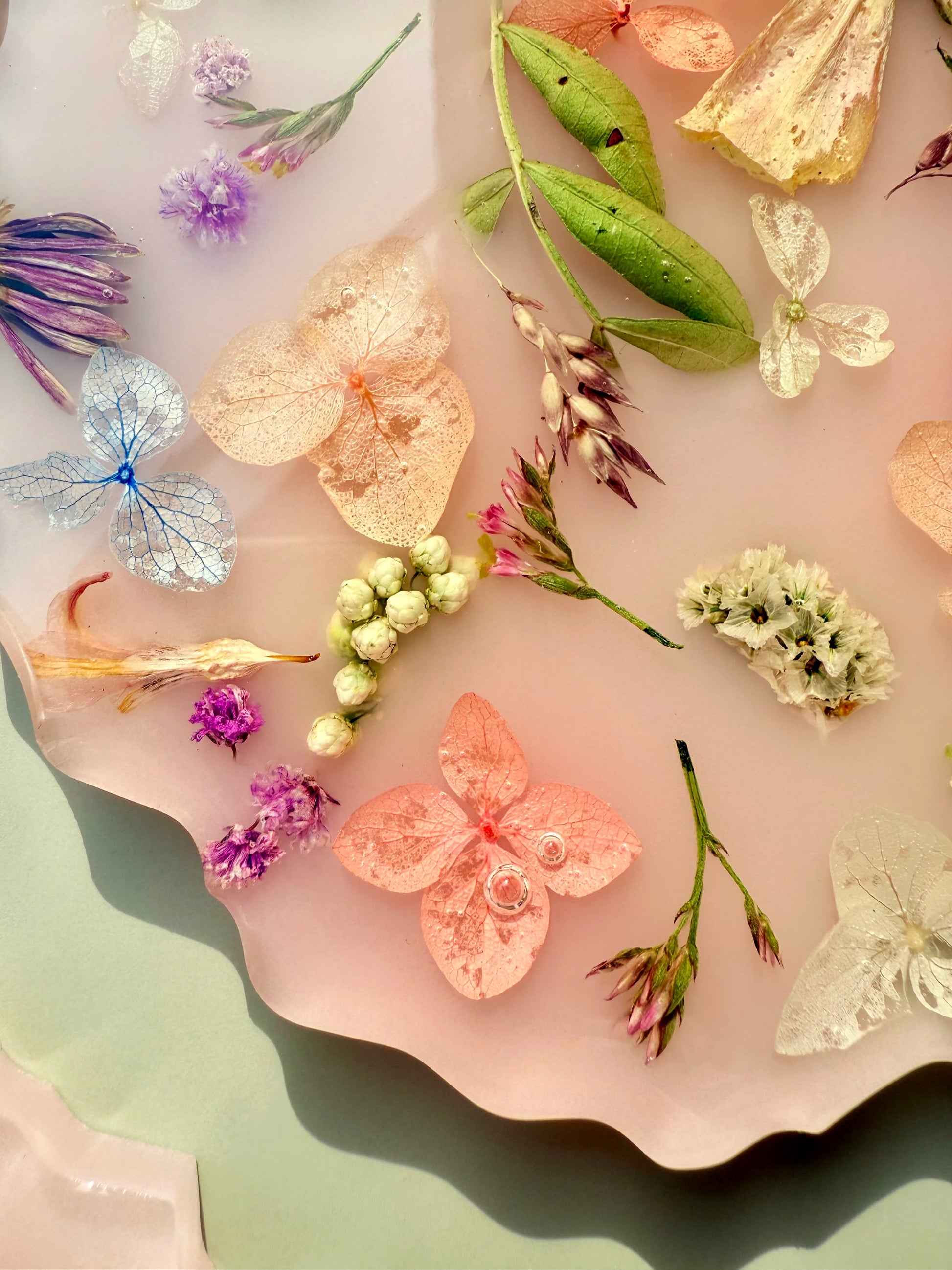 Closeup shot of a handmade floral coaster on a textured surface with a soft focus.